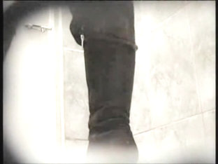 Amateur In High Boots Sits Pissing In Public Toilet