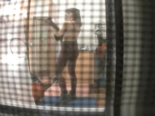 Spy Camera Catches Neighbor In Her Bedroom Undressing