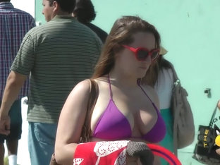 Street Candid Of A Sexy Girl In A Tight Purple Bikini Top