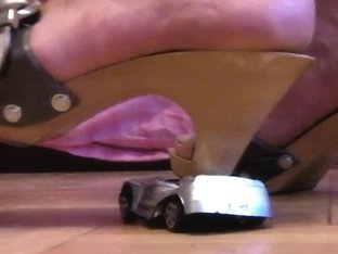 Minicar Crushing By Wooden Slippers